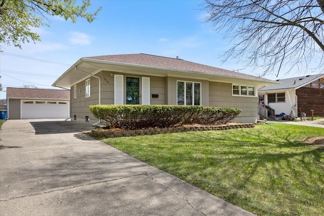 1610 Saunders Cres, Ann Arbor, MI 48103 - single story home with a shingled roof, a garage, an outdoor structure, and a front yard