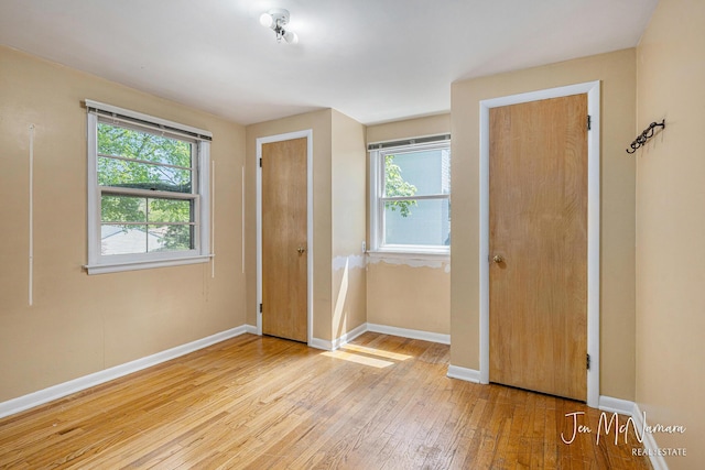 entrance foyer featuring baseboards and light wood-type flooring