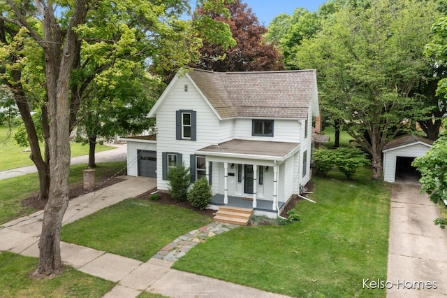 510 Division St, Big Rapids, MI 49307 - view of front facade with driveway, a porch, a shingled roof, a front yard, and an attached garage
