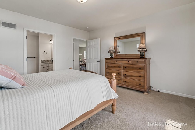 7177 Longview Ct, Delton, MI 49046 - bedroom featuring light colored carpet, baseboards, and ensuite bathroom