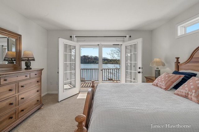 7177 Longview Ct, Delton, MI 49046 - bedroom featuring french doors, access to exterior, light colored carpet, a water view, and baseboards
