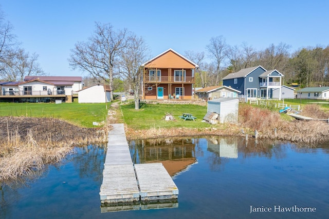7177 Longview Ct, Delton, MI 49046 - dock with a water view, a lawn, and a balcony