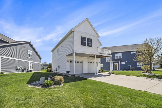 view of front of property with a balcony, driveway, board and batten siding, a garage, and a front lawn