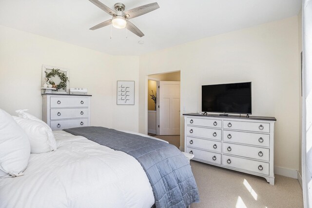 bedroom featuring light carpet, baseboards, and ceiling fan