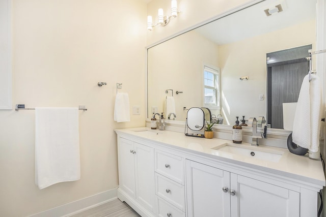 full bath featuring a sink and double vanity