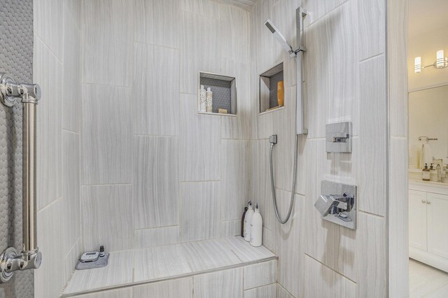 full bath featuring a tile shower