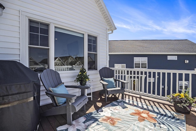wooden deck with grilling area
