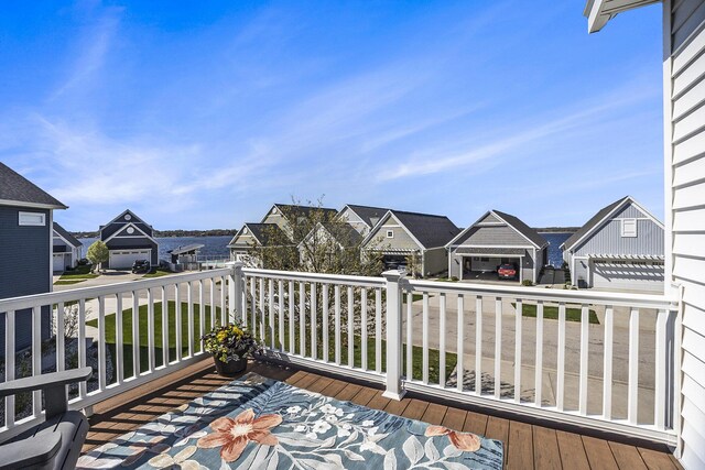 wooden deck featuring a residential view
