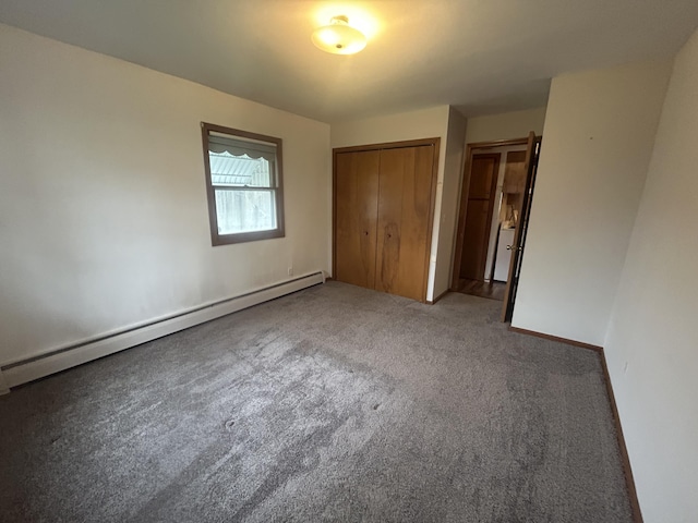 2140 Banner Dr SW, Wyoming, MI 49509 - unfurnished bedroom with a baseboard radiator, a closet, and carpet floors