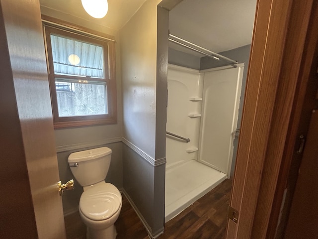 2140 Banner Dr SW, Wyoming, MI 49509 - bathroom featuring a shower, toilet, and wood finished floors