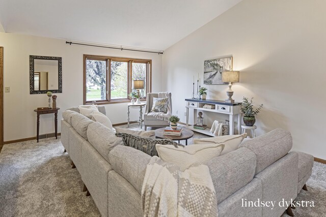 1013 Country Gdns NW, Walker, MI 49534 - carpeted living room with baseboards and vaulted ceiling