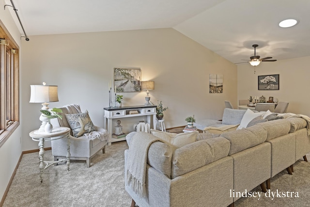 1013 Country Gdns NW, Walker, MI 49534 - carpeted living room with a ceiling fan, baseboards, and vaulted ceiling