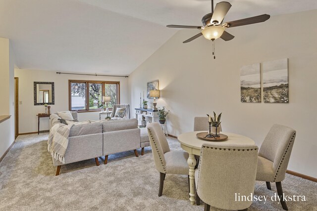 1013 Country Gdns NW, Walker, MI 49534 - dining area featuring vaulted ceiling, light carpet, baseboards, and ceiling fan