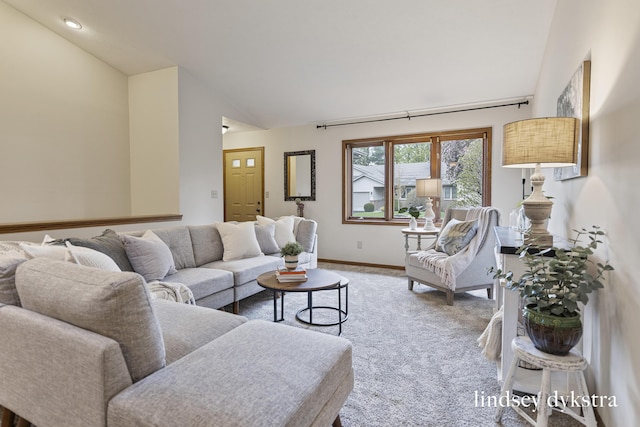 1013 Country Gdns NW, Walker, MI 49534 - living room featuring light carpet, baseboards, and high vaulted ceiling