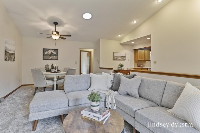 1013 Country Gdns NW, Walker, MI 49534 - living room with lofted ceiling, recessed lighting, light carpet, a ceiling fan, and baseboards