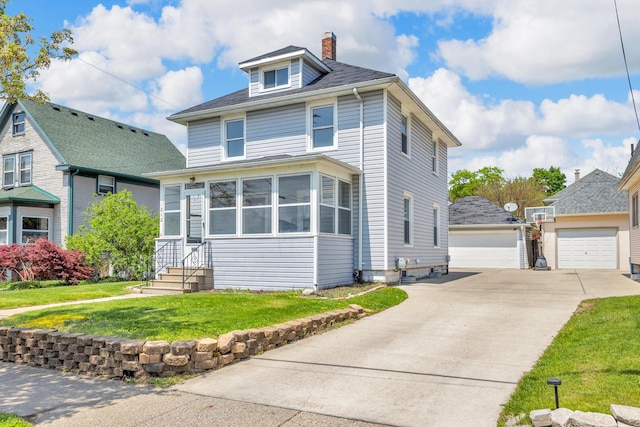 traditional style home with a chimney, a front yard, entry steps, and a detached garage