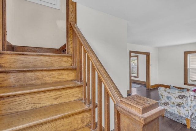 staircase with wood finished floors