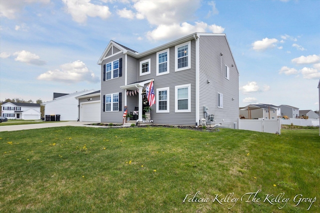 560 Pioneer Trl, Cedar Springs, MI 49319 - view of front of home featuring concrete driveway, a front lawn, and fence