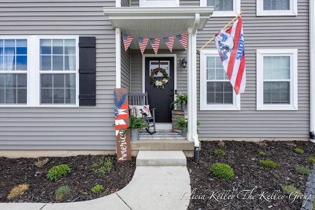 560 Pioneer Trl, Cedar Springs, MI 49319 - property entrance with a porch