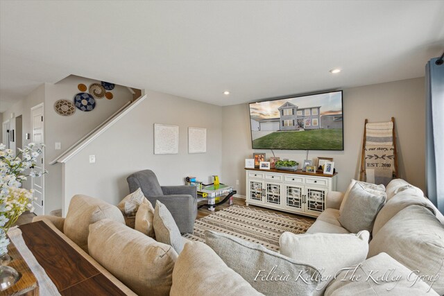560 Pioneer Trl, Cedar Springs, MI 49319 - living room with recessed lighting, wood finished floors, baseboards, and stairs