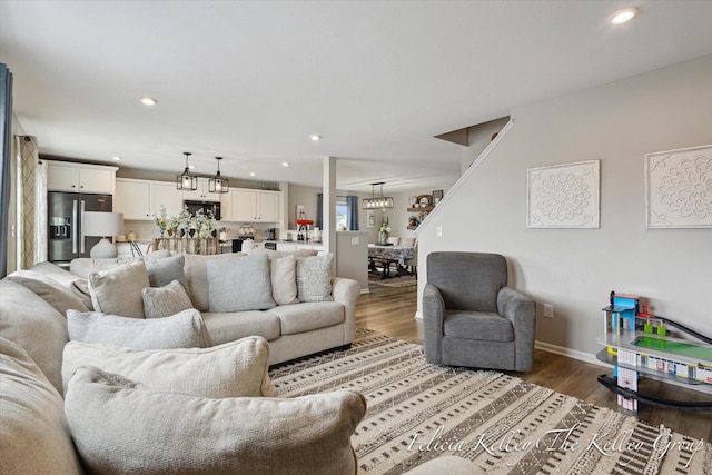 560 Pioneer Trl, Cedar Springs, MI 49319 - living room featuring a chandelier, wood finished floors, baseboards, and recessed lighting