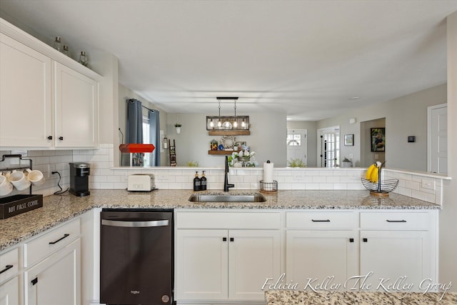 560 Pioneer Trl, Cedar Springs, MI 49319 - kitchen with dishwasher, light stone counters, a sink, decorative backsplash, and white cabinets
