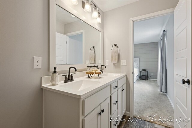 560 Pioneer Trl, Cedar Springs, MI 49319 - bathroom with baseboards, double vanity, and a sink