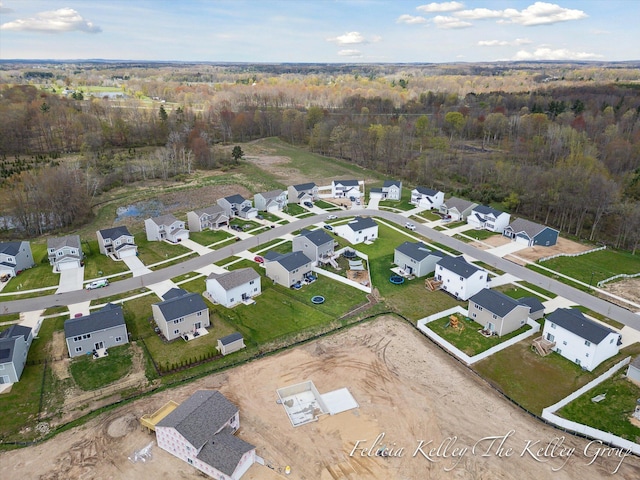 560 Pioneer Trl, Cedar Springs, MI 49319 - aerial view featuring a wooded view and a residential view