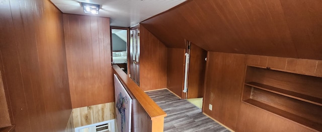 3550 Oak St, Hudsonville, MI 49426 - stairs featuring wood finished floors, vaulted ceiling, and wooden walls