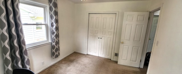 3550 Oak St, Hudsonville, MI 49426 - unfurnished bedroom featuring carpet flooring, a closet, and baseboards