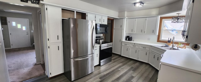 3550 Oak St, Hudsonville, MI 49426 - kitchen with appliances with stainless steel finishes, plenty of natural light, a sink, and white cabinets
