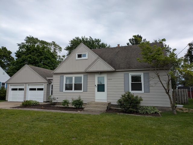 3550 Oak St, Hudsonville, MI 49426 - bungalow-style home with roof with shingles, entry steps, and a detached garage