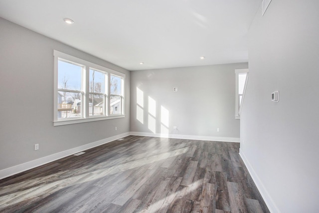 8851 Loggers Ridge Ct SE, Caledonia, MI 49316 - unfurnished living room with recessed lighting, baseboards, visible vents, and dark wood finished floors