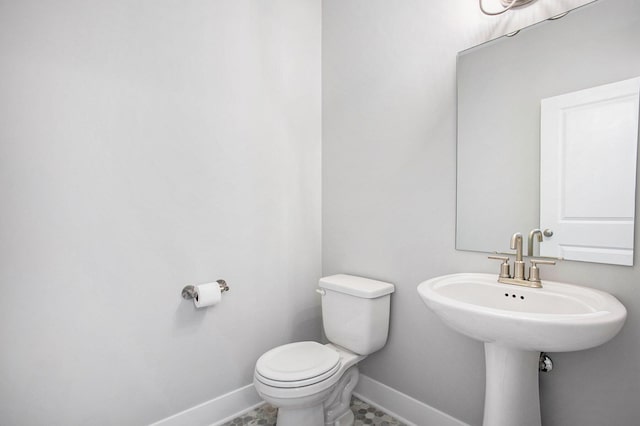 8851 Loggers Ridge Ct SE, Caledonia, MI 49316 - bathroom with toilet and baseboards
