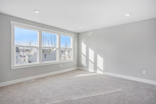 8851 Loggers Ridge Ct SE, Caledonia, MI 49316 - unfurnished living room featuring recessed lighting, visible vents, baseboards, and carpet floors