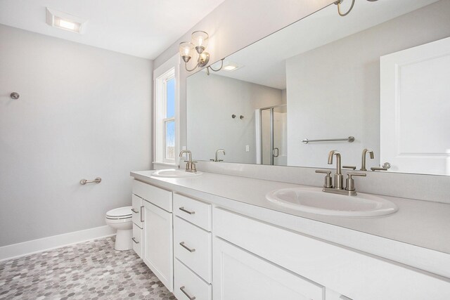 8851 Loggers Ridge Ct SE, Caledonia, MI 49316 - full bath with a sink, toilet, a stall shower, and baseboards