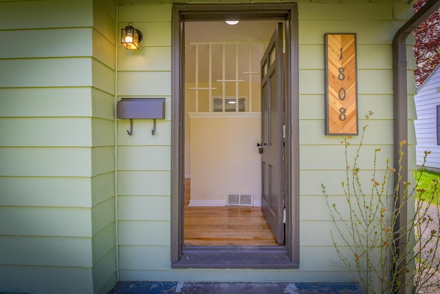 property entrance with visible vents