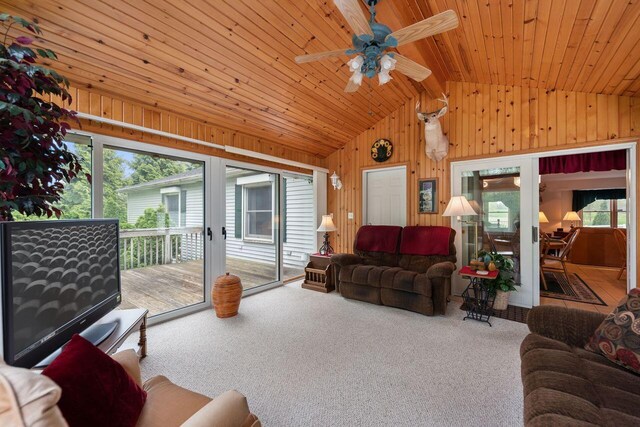 5521 W Spring Creek Rd, Three Oaks, MI 49128 - living room with vaulted ceiling, wooden walls, ceiling fan, carpet flooring, and wooden ceiling