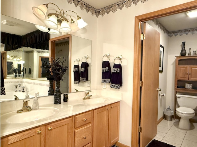 5521 W Spring Creek Rd, Three Oaks, MI 49128 - full bath featuring tile patterned floors, toilet, and double vanity