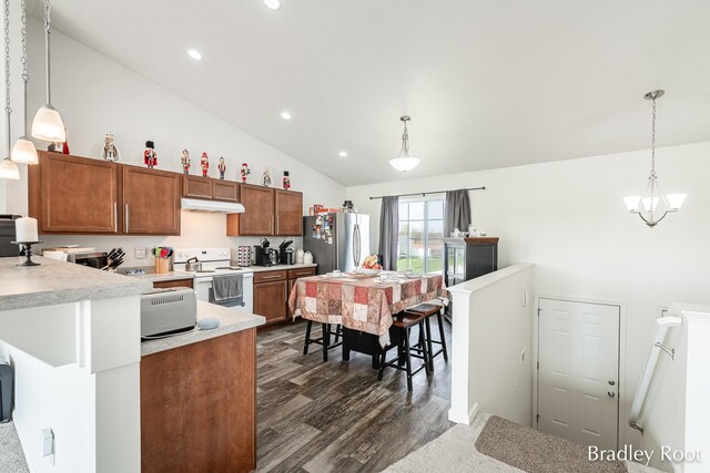 8161 W Sturtevant Ave, Richland, MI 49083 - kitchen with white electric range oven, under cabinet range hood, freestanding refrigerator, light countertops, and dark wood-type flooring