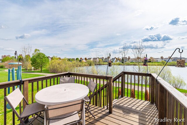 8161 W Sturtevant Ave, Richland, MI 49083 - wooden deck with a water view, outdoor dining area, and a yard