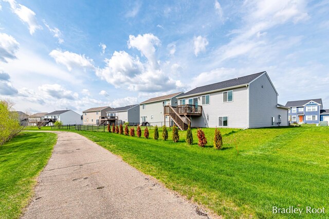 8161 W Sturtevant Ave, Richland, MI 49083 - rear view of house with a residential view, a deck, and stairway