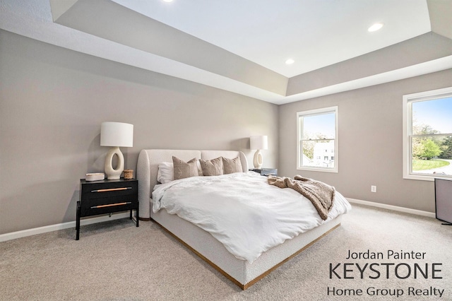 3673 Hunters Way Dr SE, Ada, MI 49301 - bedroom with baseboards, recessed lighting, light carpet, and a raised ceiling