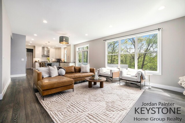 3673 Hunters Way Dr SE, Ada, MI 49301 - living room with baseboards, recessed lighting, and dark wood-type flooring