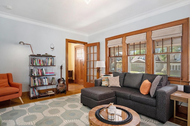 living room featuring crown molding, wood finished floors, and french doors
