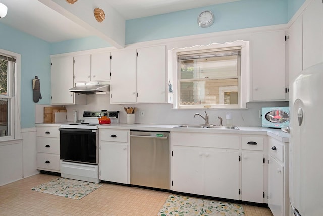 kitchen with white appliances, under cabinet range hood, a sink, and white cabinets