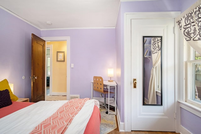 bedroom featuring crown molding
