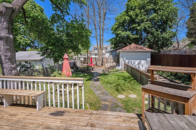 view of yard with a deck and a garage