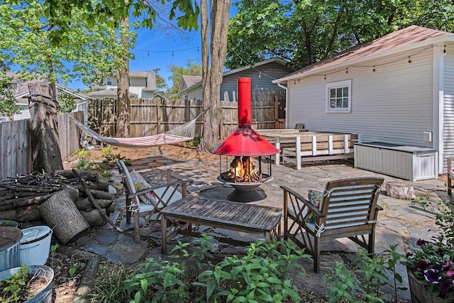 view of patio featuring a fire pit and a fenced backyard