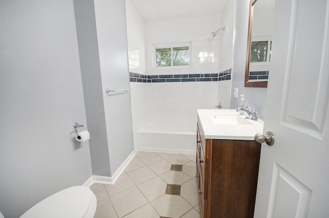 full bath with toilet, tile patterned flooring, vanity, tub / shower combination, and baseboards
